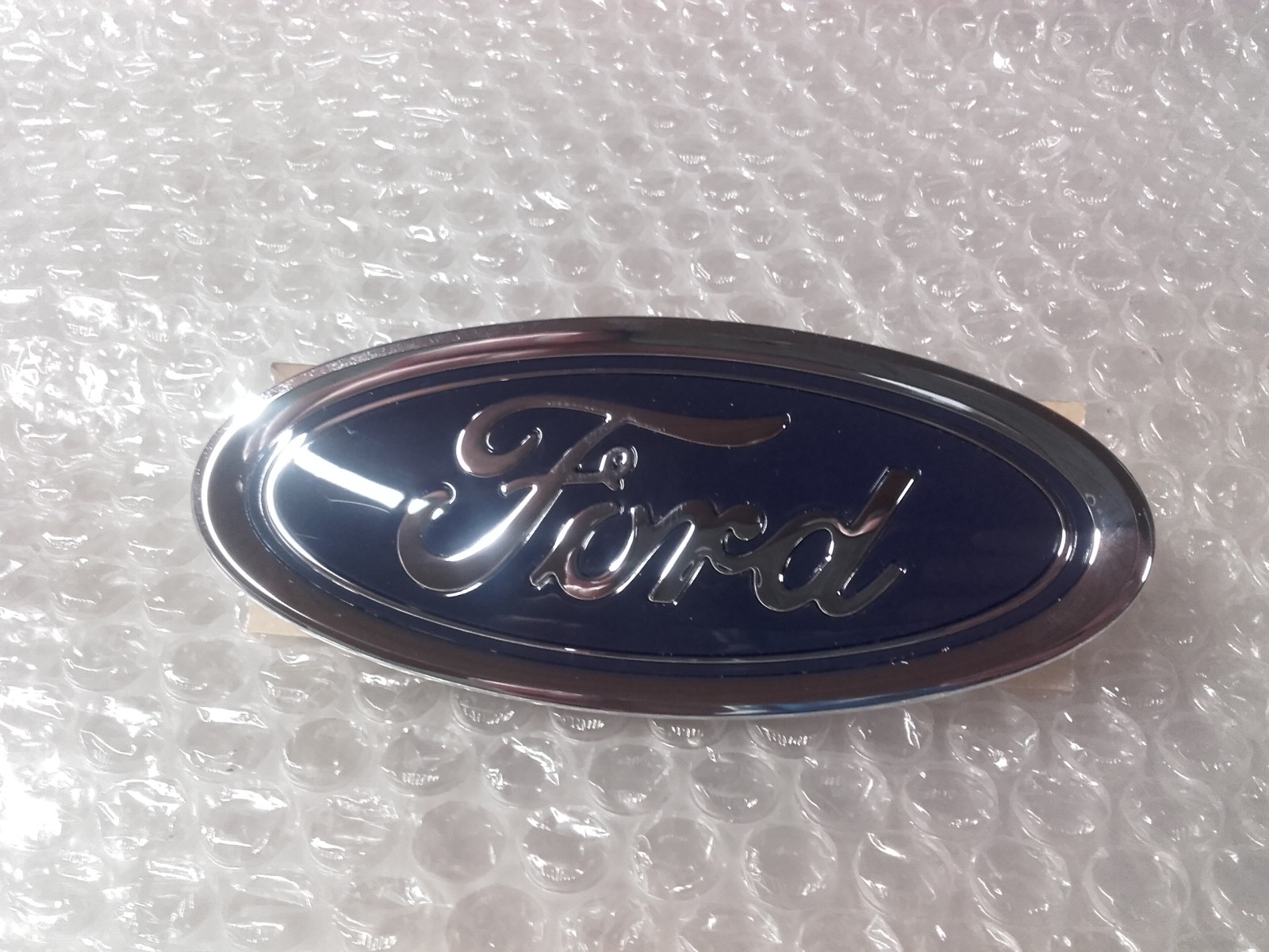 5258395-Ford Original Ford-Ornament vorne Ford Courier 2014-